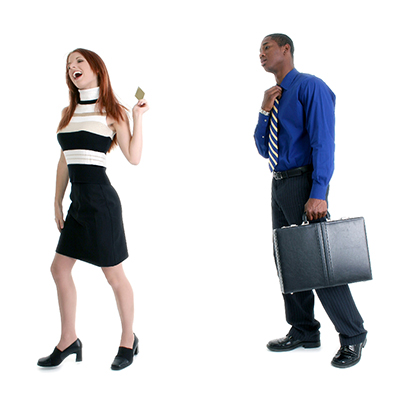 woman walking off with credit card from guy holding a briefcase